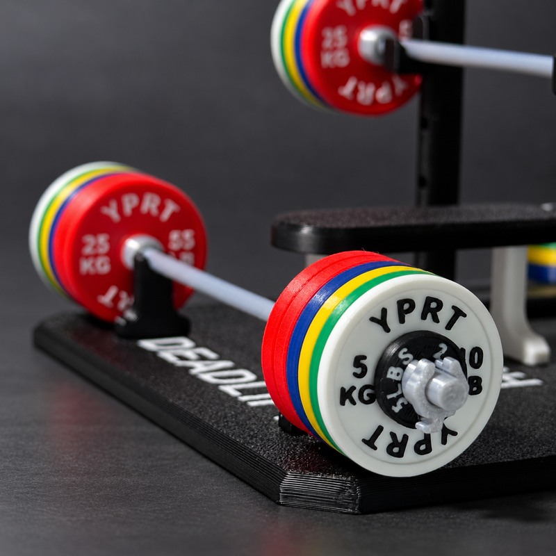 Deadlift barbell with colorful weight plates on a black rack, featuring red, white, yellow, green, and blue plates with visible YPRT branding.