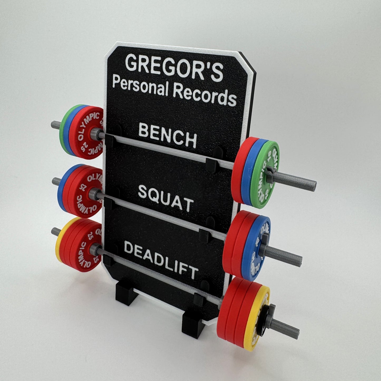 Personal records display for bench, squat, and deadlift with colorful weight plates on a white background.
